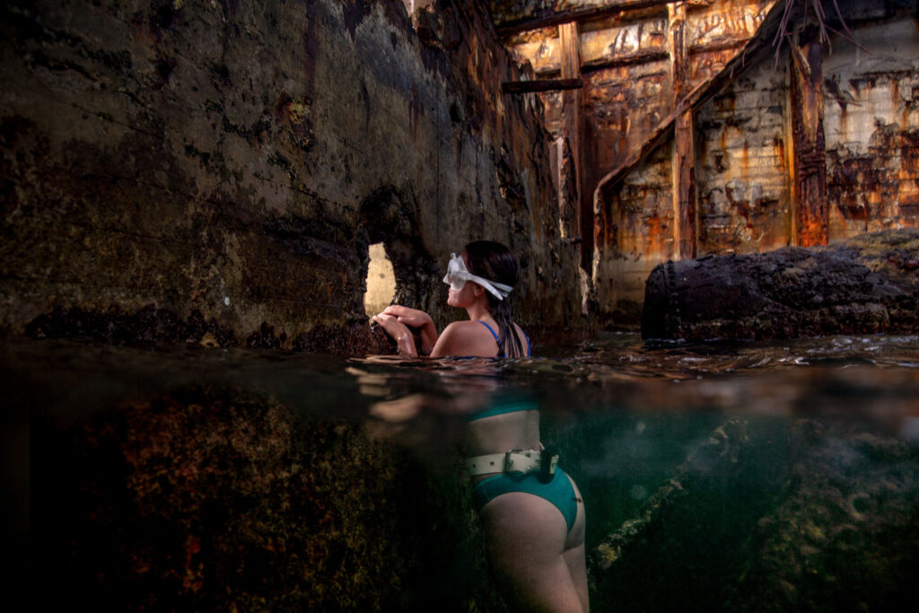 Emily inside the Sapona Shipwreck in Bimini, Bahamas